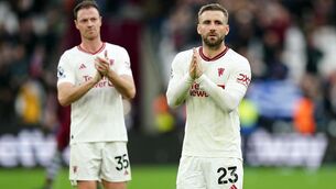 <p>Luke Shaw applauds the fans after the defeat at West Ham (Zac Goodwin/PA)</p>