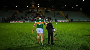<p>NEXT GEN: Bobby Boyle helps his father, Mikey carry his hurleys and helmet off the field after last January's Munster Hurling League game against Cork at Austin Stack Park. </p>