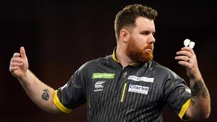 <p>ROLLING ON: Scott Williams reacts after beating Damon Heta (not pictured) on day thirteen of the Paddy Power World Darts Championship at Alexandra Palace, London. Pic: Zac Goodwin/PA Wire.</p>