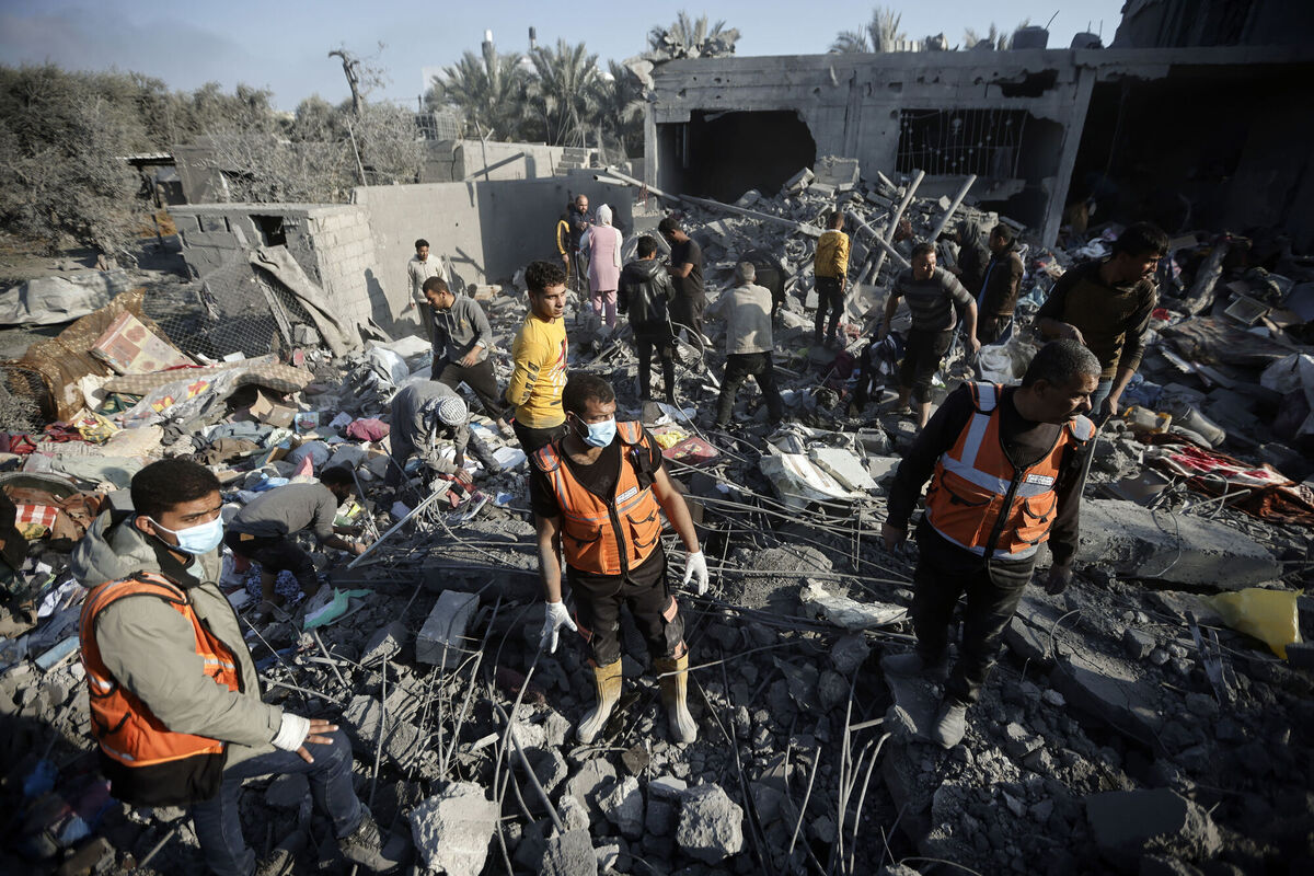 Palestinians inspect the damage of a destroyed house following Israeli airstrikes on Khan Younis, Southern Gaza Strip, Sunday, Dec. 31, 2023. Picture: AP Photo/Mohammed Dahman