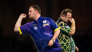 <p>Luke Littler in action against Brendan Dolan (not pictured) on day fourteen of the Paddy Power World Darts Championship at Alexandra Palace, London. Picture: Zac Goodwin/PA Wire. </p>