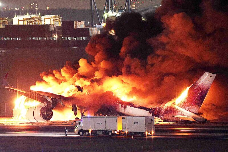A Japan Airlines plane is on fire on the runway of Tokyo’s Haneda airport. Picture: STR/JIJI PRESS/AFP via Getty Images A Japan Airlines plane is on fire on the runway of Tokyo’s Haneda airport. Picture: STR/JIJI PRESS/AFP via Getty Images