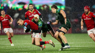 <p>'BOUNCE OF A BALL': Munster's Shane Daly is tackled by Mack Hansen of Connacht. Pic: ©INPHO/James Crombie</p>