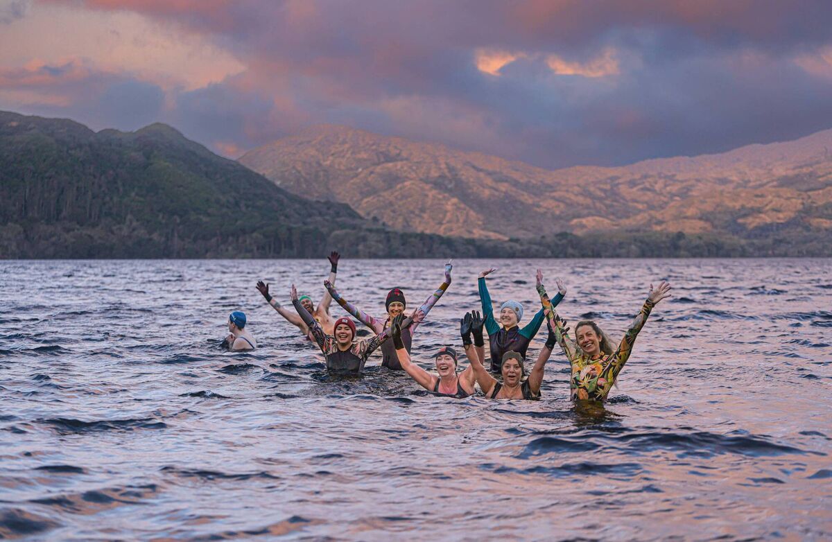 Hardy swimmers taking part in the Nature Valley Wander WIld Festival Sunrise Dip in Dundag, with the Salty Sister, Muckross Lake, Killarney National Park