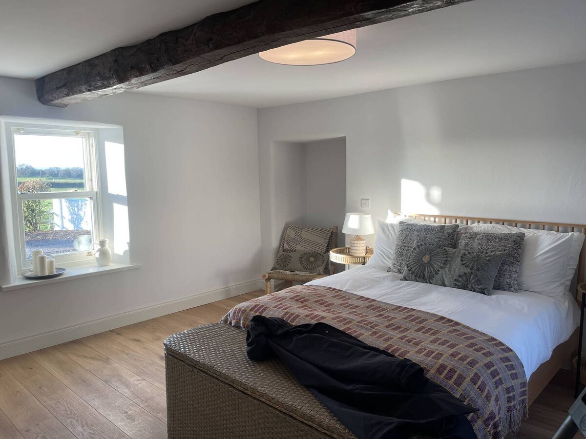 The bedroom with original beam.