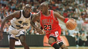 <p>Michael Jordan drives past Orlando Magic forward Charles Outlaw.</p>