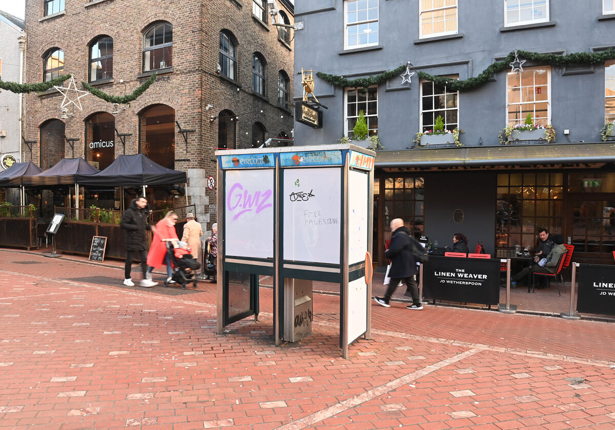  A pair of disused and vandalised telephone boxes at Rory Gallagher Place, Paul Street, Cork. The doors have been screwed shut on these boxes to prevent entry. Picture: Larry Cummins