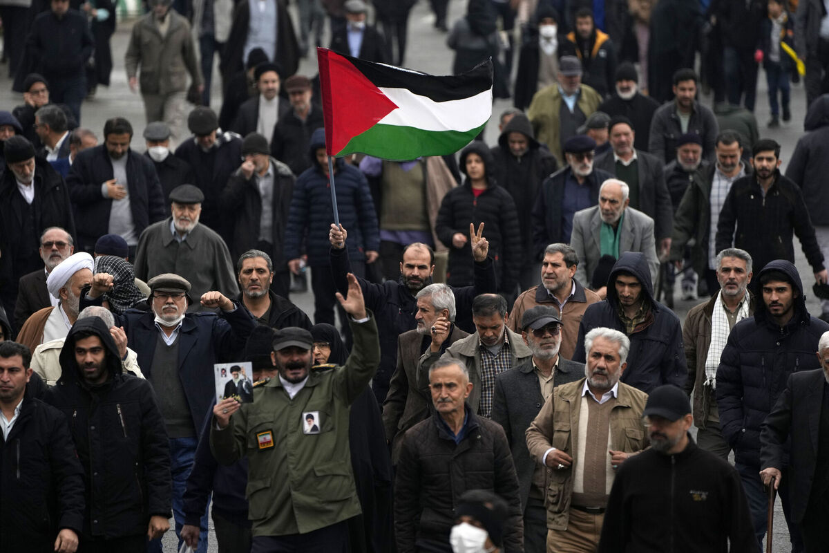 A man holds up a Palestinian flag during a demonstration in which worshippers show their support of Palestinians and condemning the US and British militaries strike against Iranian-backed Houthis in Yemen, after Friday prayer in Tehran, Iran. Picture: AP Photo/Vahid Salemi A man holds up a Palestinian flag during a demonstration in which worshippers show their support of Palestinians and condemning the US and British militaries strike against Iranian-backed Houthis in Yemen, after Friday prayer in Tehran, Iran. Picture: AP Photo/Vahid Salemi