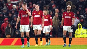 <p>TRAPPED: Manchester United players look dejected after Bournemouth's Marcos Senesi (not pictured) scores their side's third goal of the game. Pic: Martin Rickett/PA Wire.</p>