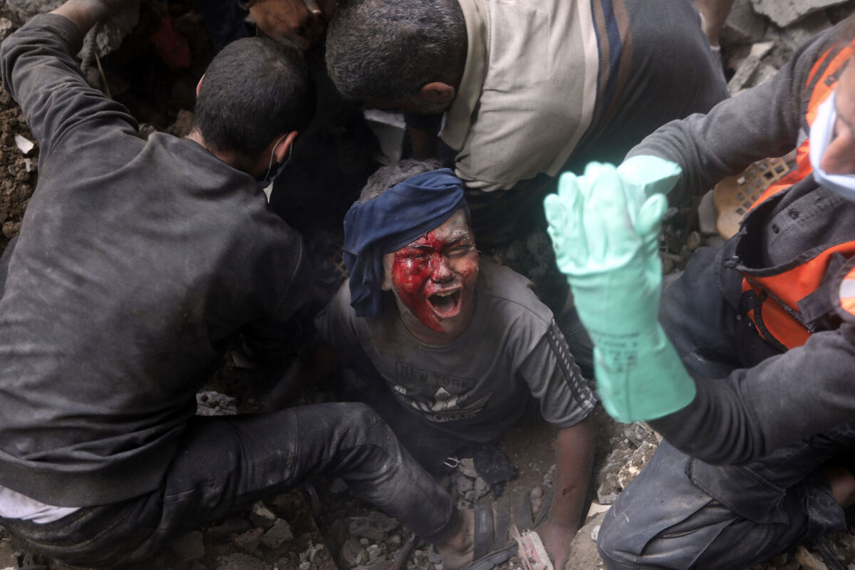 An injured Palestinian boy cries as rescuers try to pull him out of the rubble of a destroyed building following an Israeli airstrike in Bureij refugee camp, Gaza Strip. File picture: AP Photo/Mohammed Dahman