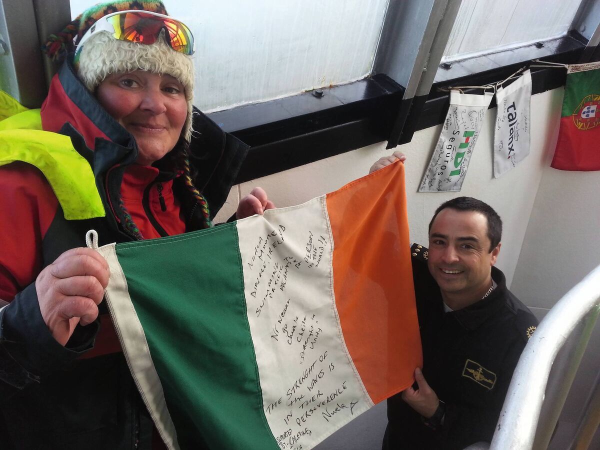 Nuala Moore with the Tricolour in the Lighthouse at Cape Horn