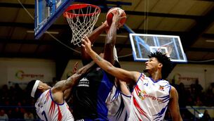 <p>Neptune’s Andrew Gardner and Derek Murphy with Elijah Tilman of UCC Blue Demons.</p>