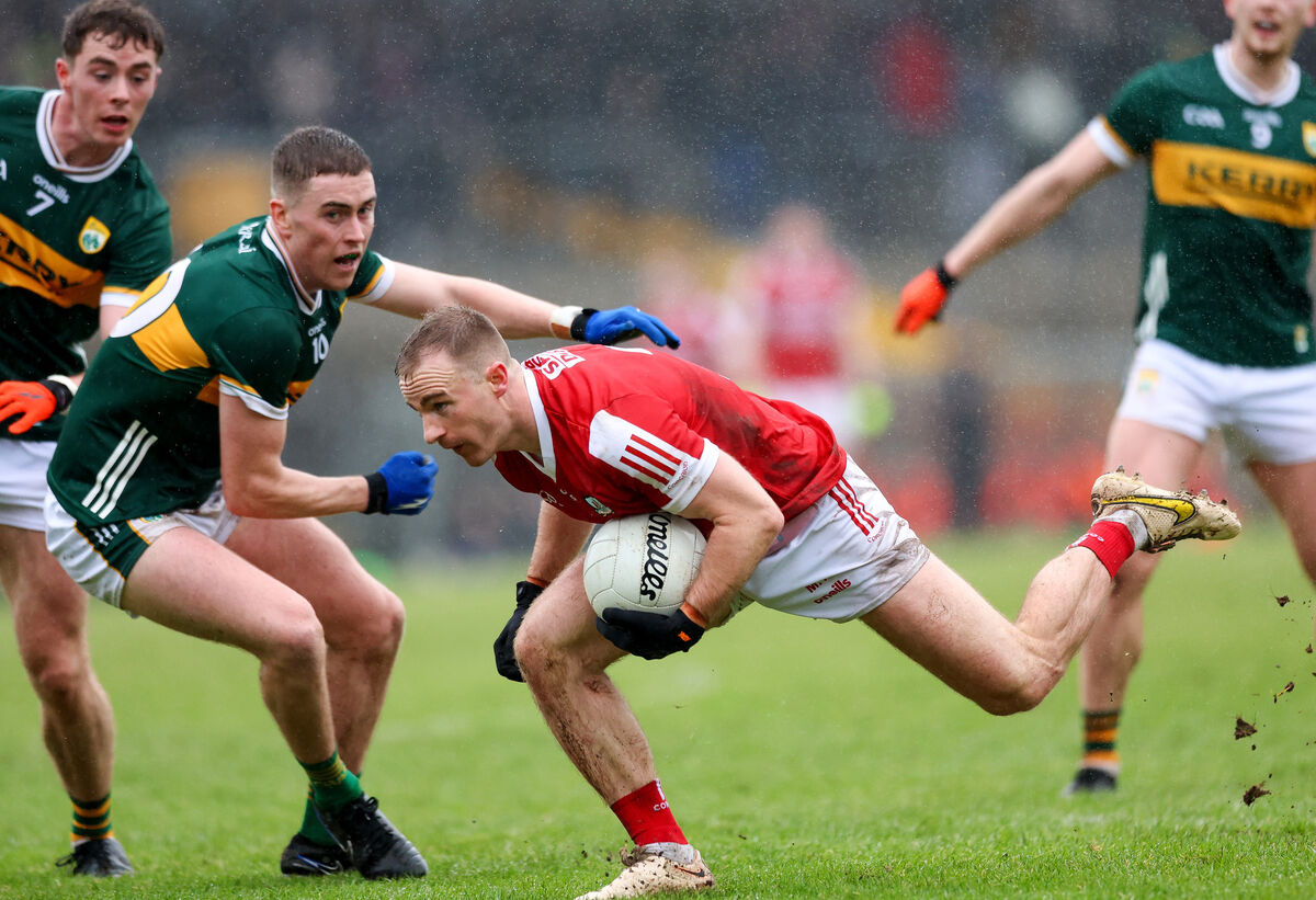 Matty Taylor of Cork with Ronan Buckley of Kerry.