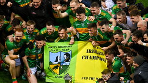 <p>21 January 2024; Glen players celebrate with the Andy Merrigan Cup after their side's victory the AIB GAA Football All-Ireland Senior Club Championship Final match between Glen of Derry and St Brigid's of Roscommon at Croke Park in Dublin. Photo by Sam Barnes/Sportsfile Photo by Sam Barnes/Sportsfile</p>