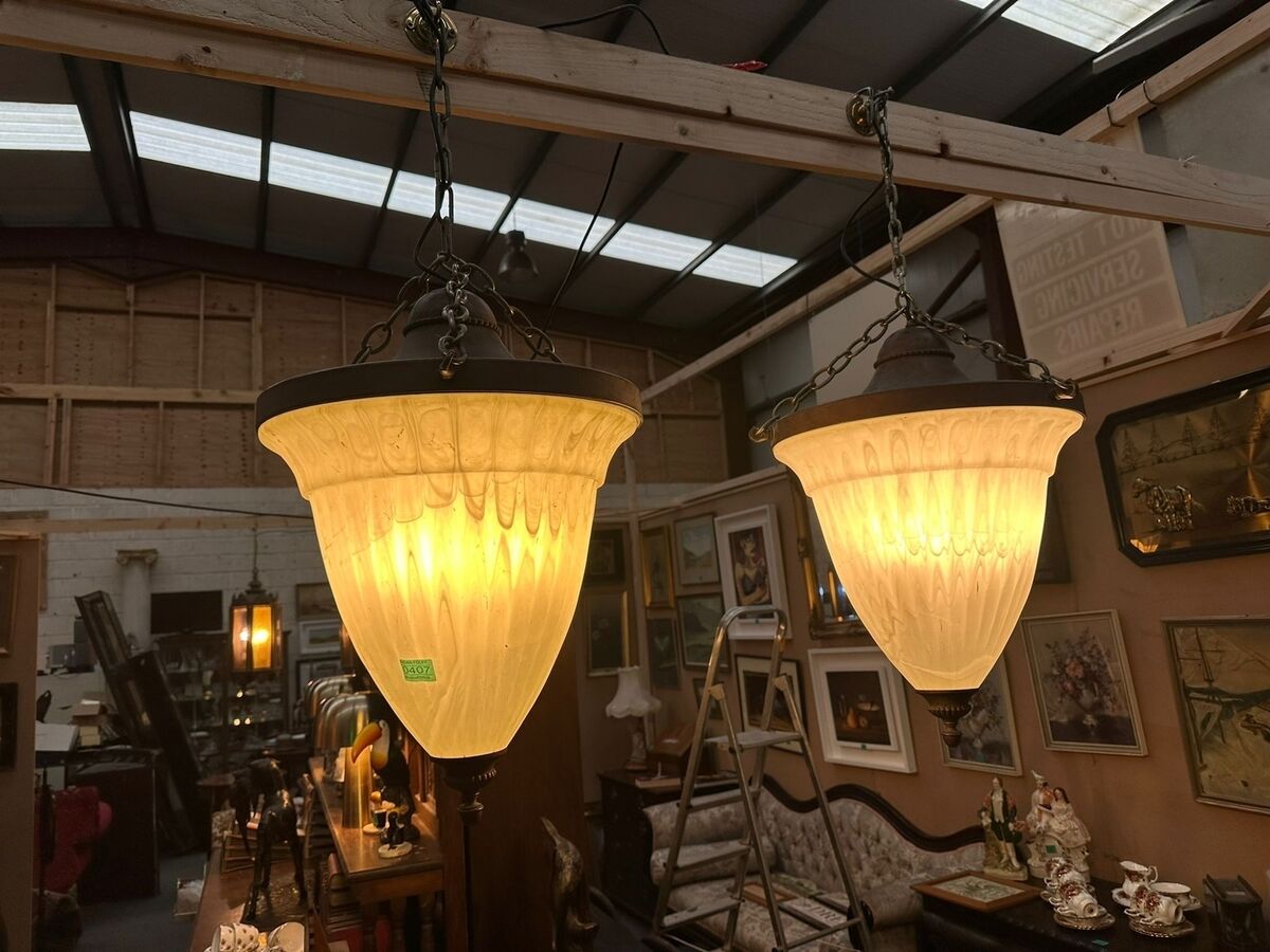 A pair of decorative metal and glass light fittings at Aidan Foley's sale. A pair of decorative metal and glass light fittings at Aidan Foley's sale.