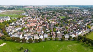 <p>Aerial view of Poundbury village, England. Poundbury reflects King Charles III's traditional approach to architecture and urban planning. Picture: Finnbarr Webster/Getty Images</p>