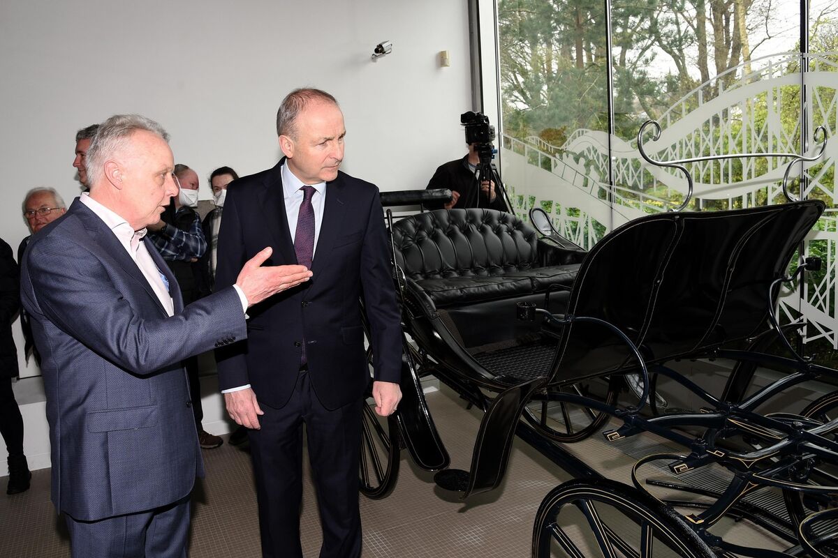 Carriage of sale: An Tánaiste, Micheál Martin, T.D. pictured with Mark Whitaker , CEO of JPMG Motor Group at the donation of  a carriage from the original Johnson &amp; Perrott garage in Emmet Place, Cork with other artifacts to Cork Public Museum in Fitzgeralds Park. Picture: Adrian O'Herlihy