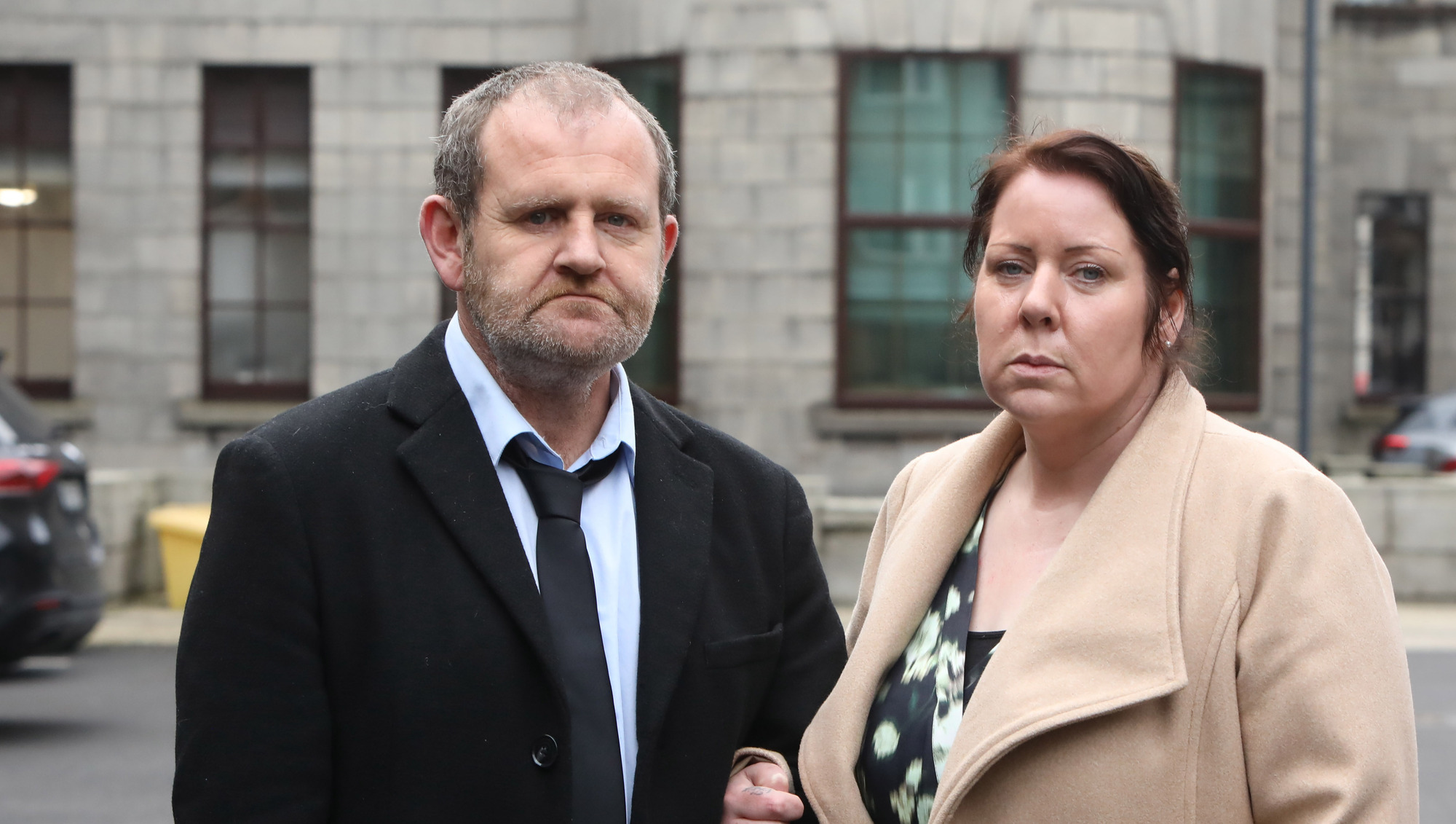 Barry Cleary and his wife Melanie Sheehan Cleary outside the Four Courts: Mr Cleary said when they returned to the hospital emergency department on the morning of July 20, Eve's leg from her toes up looked swollen and was 'like a Christmas ham'. Picture: Collins Courts