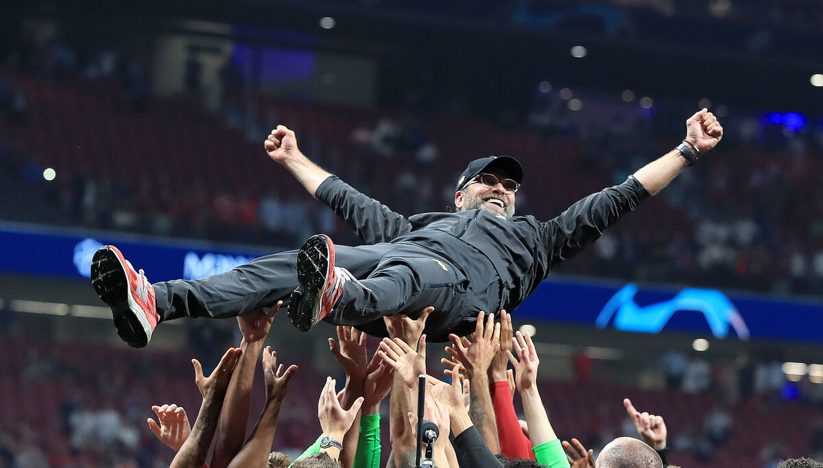 File photo dated 01/06/19. Liverpool manager Jurgen Klopp is lifted up by his players after winning the UEFA Champions League Final at the Wanda Metropolitano, Madrid. Jurgen Klopp has shocked the world of football by announcing he will stand down as Liverpool manager at the end of the season after admitting he is “running out of energy”. 