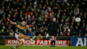 <p>27 January 2024; Sean O'Shea of Kerry slips as he takes a free in the final minutes of the Allianz Football League Division 1 match between Kerry and Derry at Austin Stack Park in Tralee, Kerry. Photo by Brendan Moran/Sportsfile</p>