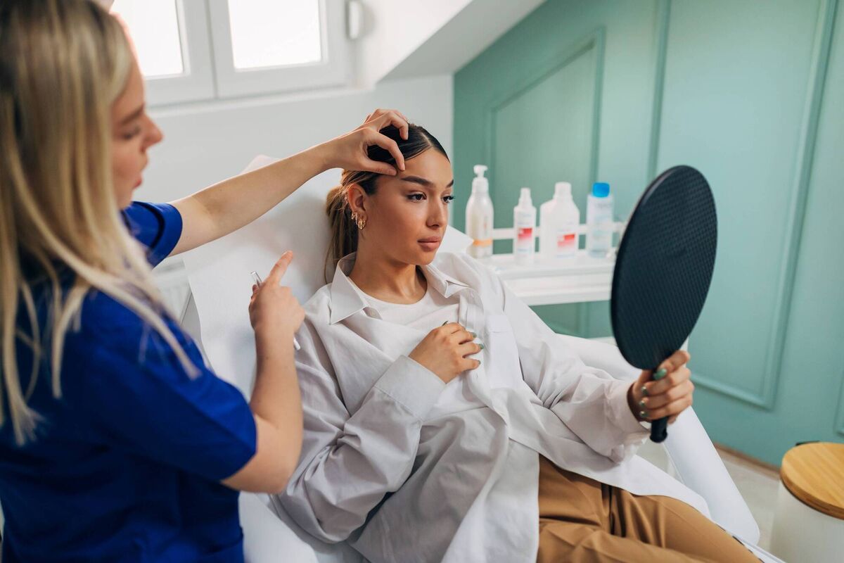 A woman receiving a brow lift. Beauty journalist Mary-Jane O’Regan says she doesn't intend to stop getting fillers. See below. Picture: iStock 