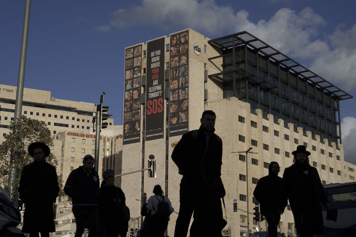 People walk past billboard displaying photographs of youth hostages who were abducted during the Oct. 7, unprecedented Hamas attack on Israel, in Jerusalem, Israel, Tuesday, Jan. 30, 2024. (AP Photo/Leo Correa) People walk past billboard displaying photographs of youth hostages who were abducted during the Oct. 7, unprecedented Hamas attack on Israel, in Jerusalem, Israel, Tuesday, Jan. 30, 2024. (AP Photo/Leo Correa)