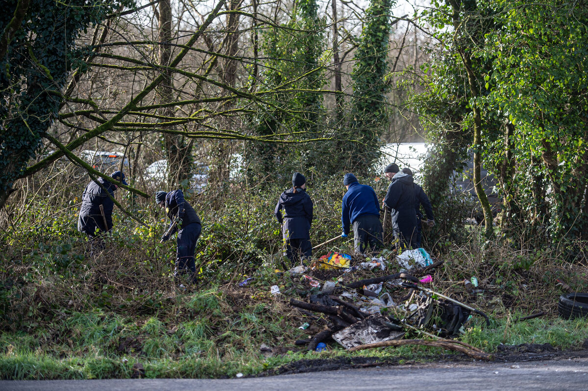  A Garda team searching the undergrowth at Whitewell Cross. Picture: Dan Linehan