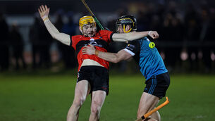 <p>BALANCING ACT: UCC's Shane Barrett battles with Maynooth's Conan Boran  in Thursday's Fitzgibbon Cup clash at the Mardyke. 	Picture: Jim Coughlan</p>