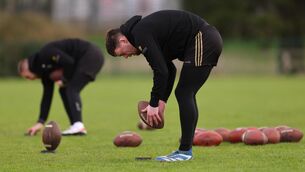 <p>NEW CHALLENGE: Rory Beggan lines up to kick an American football. Pic Credit: James Crombie, Inpho.</p>