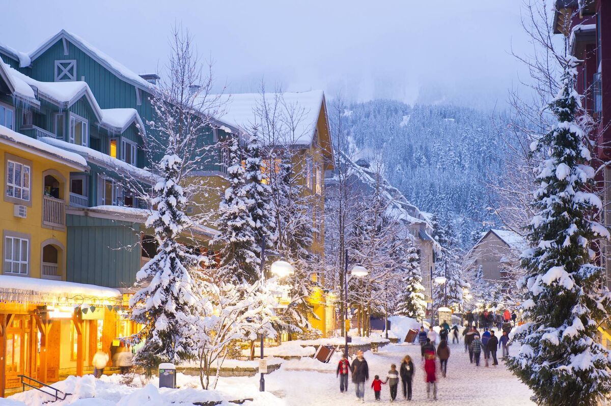 Whistler's world-class pedestrian village filled with shops, hotels and restaurants blanketed with fresh snow at dusk Whistler's world-class pedestrian village filled with shops, hotels and restaurants blanketed with fresh snow at dusk