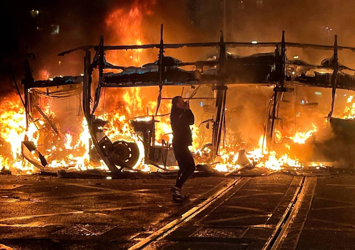 A burning bus on Dublin’s O’Connell Bridge during riots in Dublin City Centre in the aftermath of a knife attack on school children on Parnell Square. Picture: Alan Betson / The Irish Times