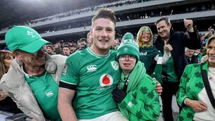 <p>MAC ATTACK: Ireland’s Joe McCarthy gives his Guinness Player of the Match medal to his brother Andrew alongside his father Joe and mother Paula. Pic: Dan Sheridan, Inpho</p>