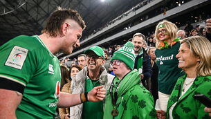 <p>FAMILY AFFAIR: Joe McCarthy of Ireland gives his man-of-the-match award to his brother Andrew. Pic: Harry Murphy/Sportsfile</p>