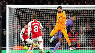 <p>MIX UP: Arsenal's Gabriel Martinelli scores their side's second goal of the game after Liverpool goalkeeper Alisson Becker and Virgil van Dijk fail to clear the ball: Picture: John Walton/PA Wire..</p>
