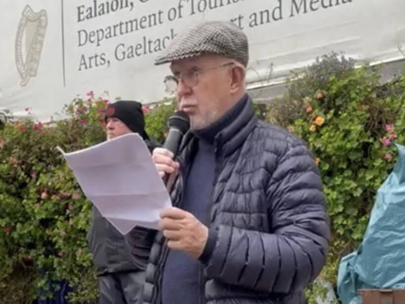 William Wall reads at an event in support of Palestinians. 