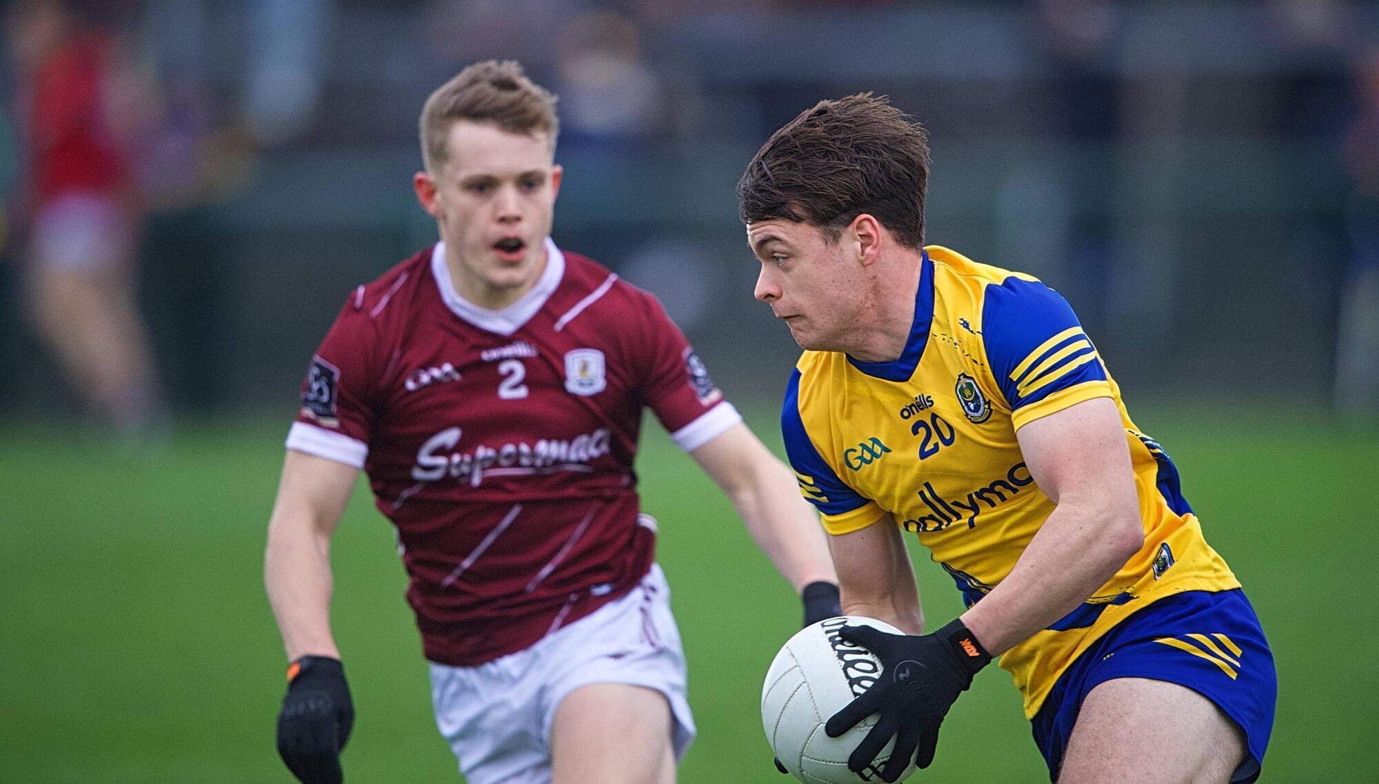 Ben O'Carroll sets his sights on goal as Johnny McGrath closes in. 
