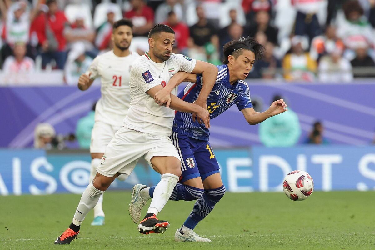 Maikuma Seiya of Japan is challenged by Omid Ebrahimi Zarandini of Iran during the AFC Asian Cup quarter-final. Maikuma Seiya of Japan is challenged by Omid Ebrahimi Zarandini of Iran during the AFC Asian Cup quarter-final.