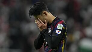 <p>CHEERS, SONS CRYING: South Korea's Son is dejected after their loss. AP Photo/Thanassis Stavrakis.</p>