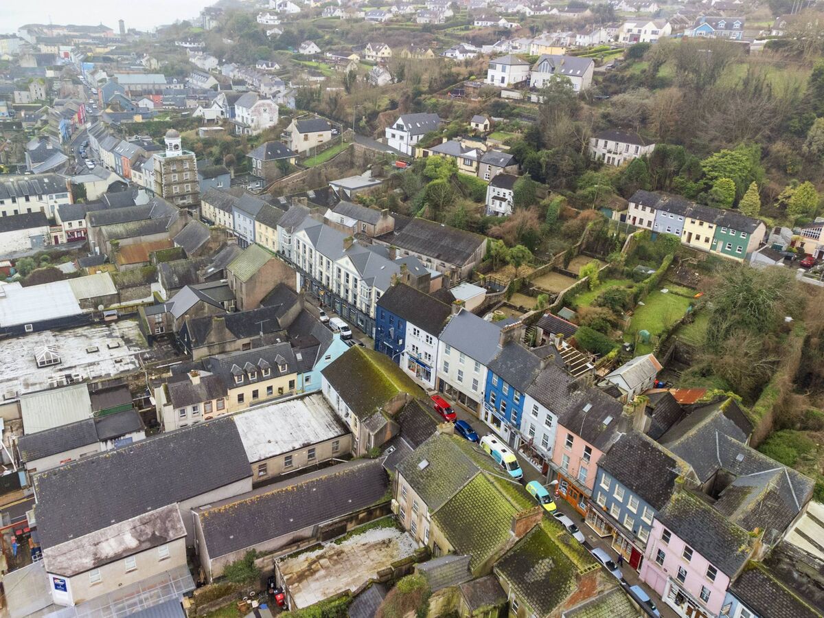 77 Main Street Youghal, centre of pic, navy building next to Merrick's store