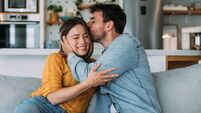 Happy couple at home.