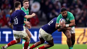 <p>GREEN GIANTS: France's Jonathan Danty tackles Ireland's power centre Bundee Aki. Jack Crowley awaits developments. Pic: Ben Brady, Inpho </p>