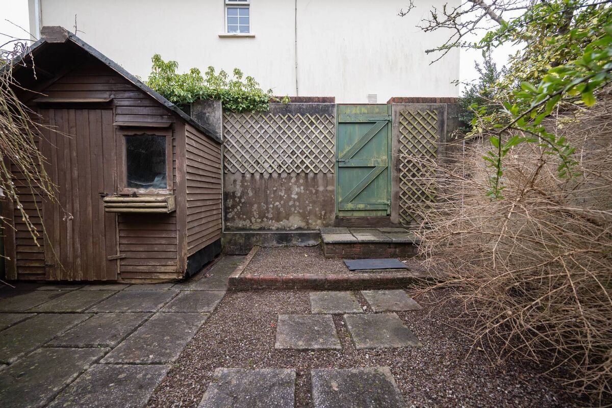 Useful rear pedestrian gate to south-facing paved courtyard garden