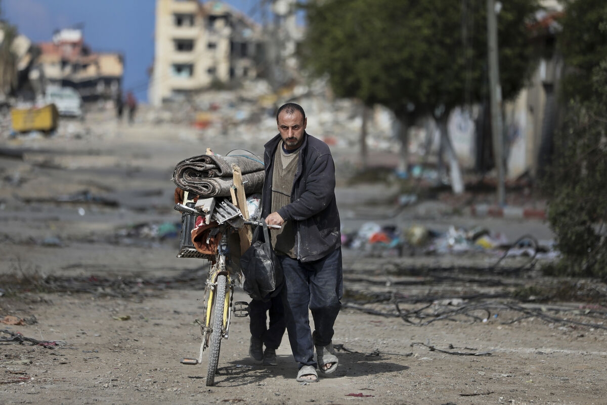 Palestinians walk through the destruction left by the Israeli air and ground offensive on the Gaza Strip in Gaza City, Saturday, Feb. 10, 2024. Picture: AP Photo/Mohammed Hajjar