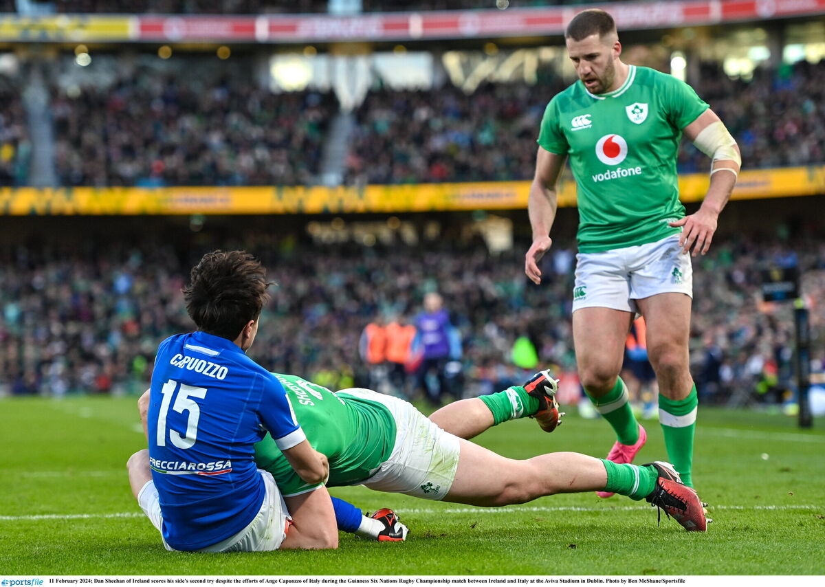 Dan Sheehan of Ireland scores his side's second try despite the efforts of Ange Capuozzo of Italy during the Guinness Six Nations Rugby Championship match between Ireland and Italy at the Aviva Stadium in Dublin. Photo by Ben McShane/Sportsfile