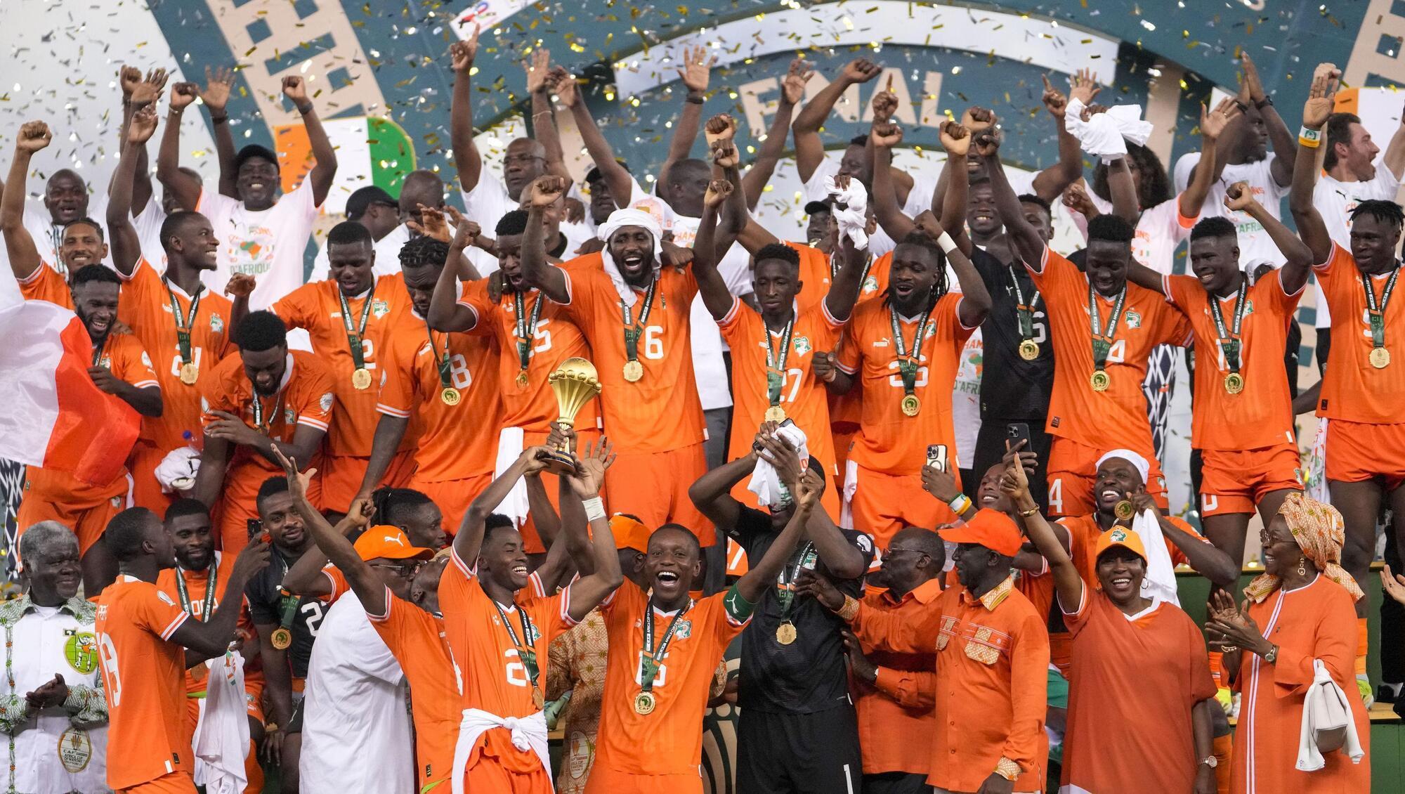 Ivory Coast players celebrate after winning the African Cup of Nations.