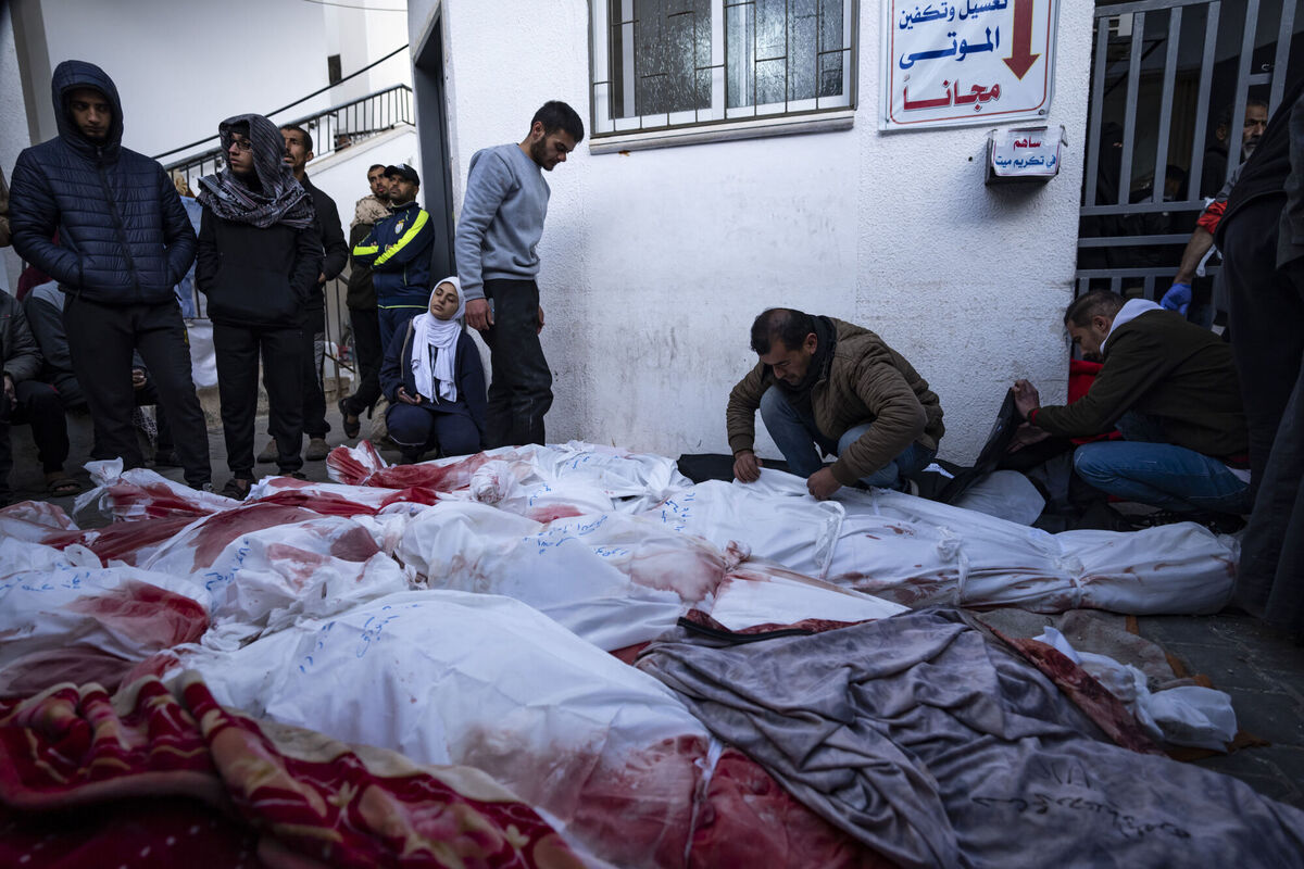 Palestinians mourn relatives killed in the Israeli bombardment of the Gaza Strip at a hospital morgue in Rafah, Monday, Feb. 12, 2024. (AP Photo/Fatima Shbair)