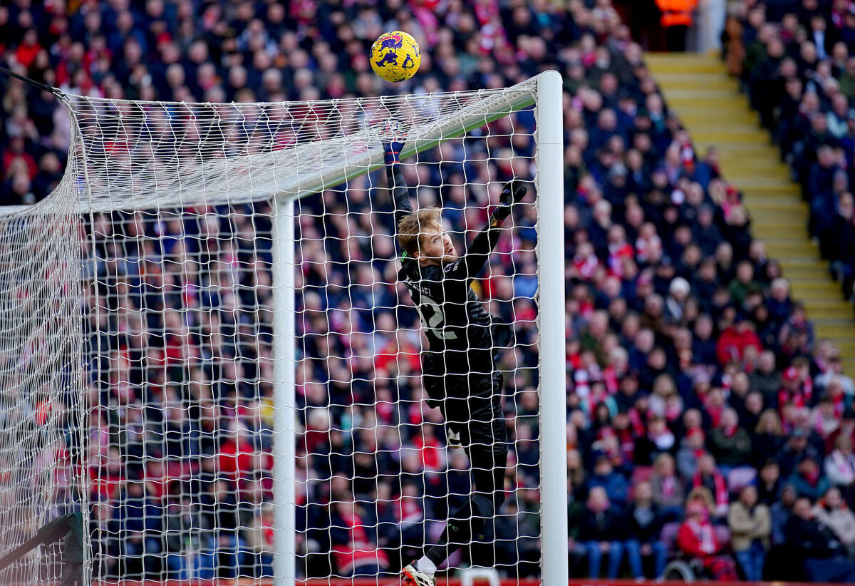 The ball hits the cross bar as Liverpool goalkeeper Caoimhin Kelleher jumps to make a save. Photo credit: Peter Byrne/PA Wire. The ball hits the cross bar as Liverpool goalkeeper Caoimhin Kelleher jumps to make a save. Photo credit: Peter Byrne/PA Wire.