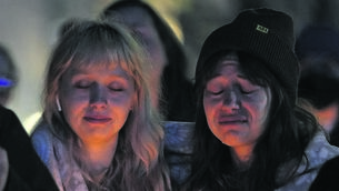 <p>GRIM REALITY: Abbie Lewis, left, and Jackie Batista-Martinez attend a candlelight vigil for the victims of a shooting at a Kansas City Chiefs Super Bowl victory rally last week. More than 20 people were injured and one woman was killed in the shooting near Union Station. <span class="contextmenu emphasis CaptionCredit">Pic: Charlie Riedel, AP</span>
            </p>