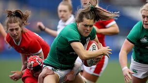 <p>DOUBLE JOBBING: Beibhinn Parsons of Ireland is tackled by Donna Rose of Wales during the 2021 Women's Six Nations Rugby Championship. Picture: Chris Fairweather/Sportsfile</p>