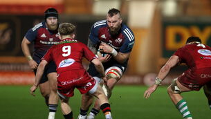 <p>COLOSSUS: RG Snyman of Munster is challenged by Archie Hughes of Scarlets. Pic: Chris Fairweather, Sportsfile</p>